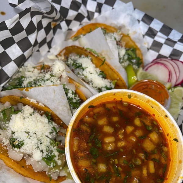 El Burro Loco birria tacos with cheese, cilantro, onions, and a side of consommé.